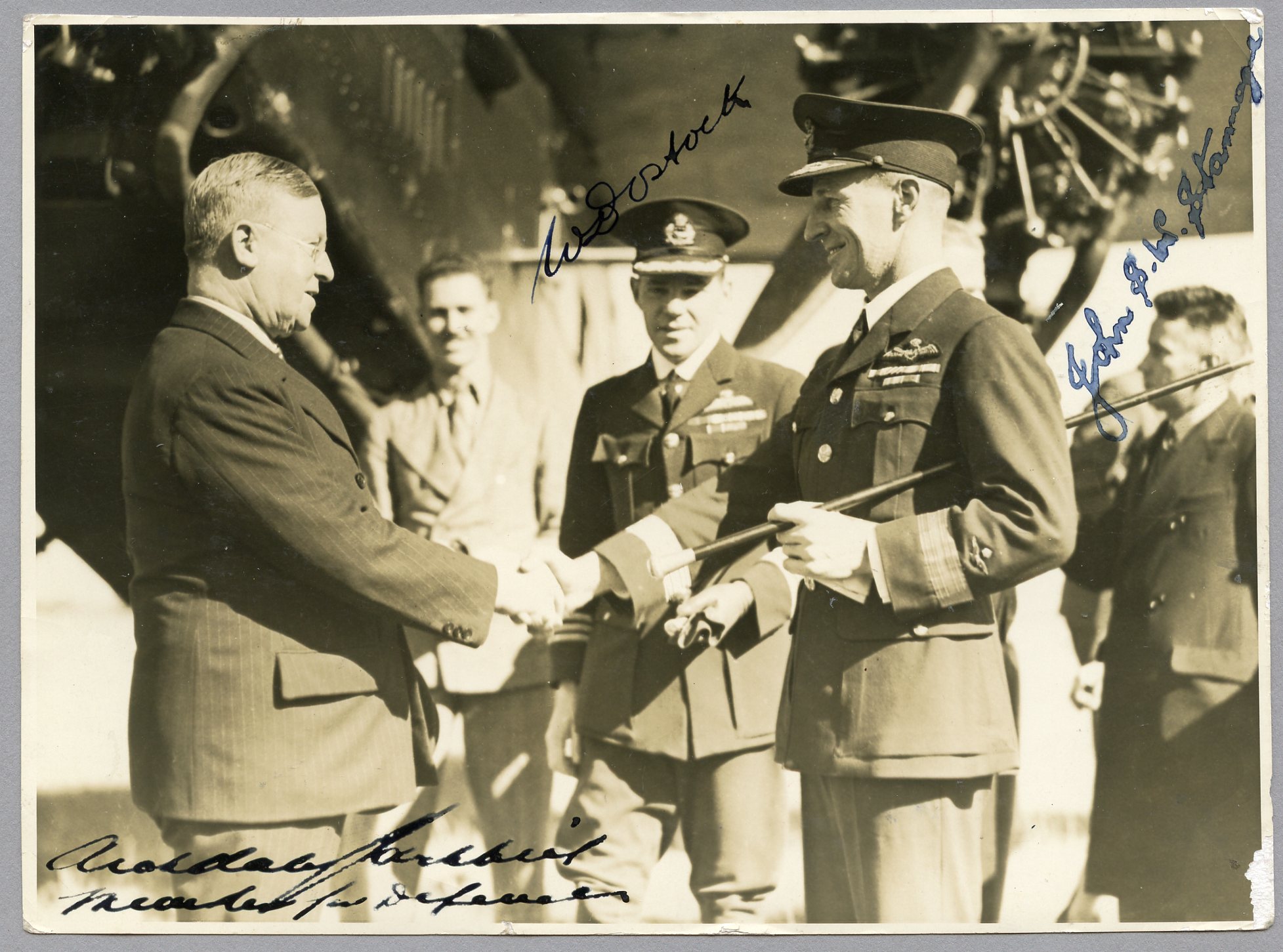 Photograph of Kingsford Smith with Minister for Defence handing over the "Southern Cross" aircraft at Richmond, NSW, 1935