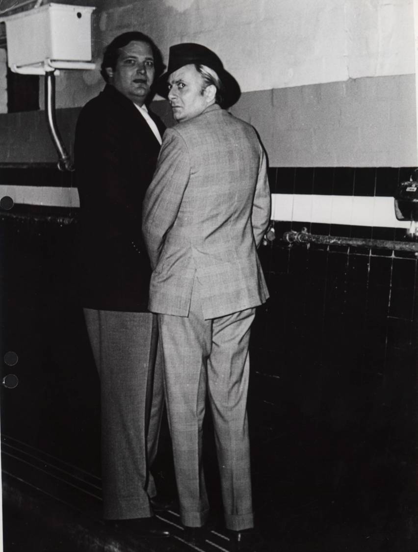 'Taking a leak' photograph of Clyde Packer and Barry Humphreys at Luna Park by Janice Wakely