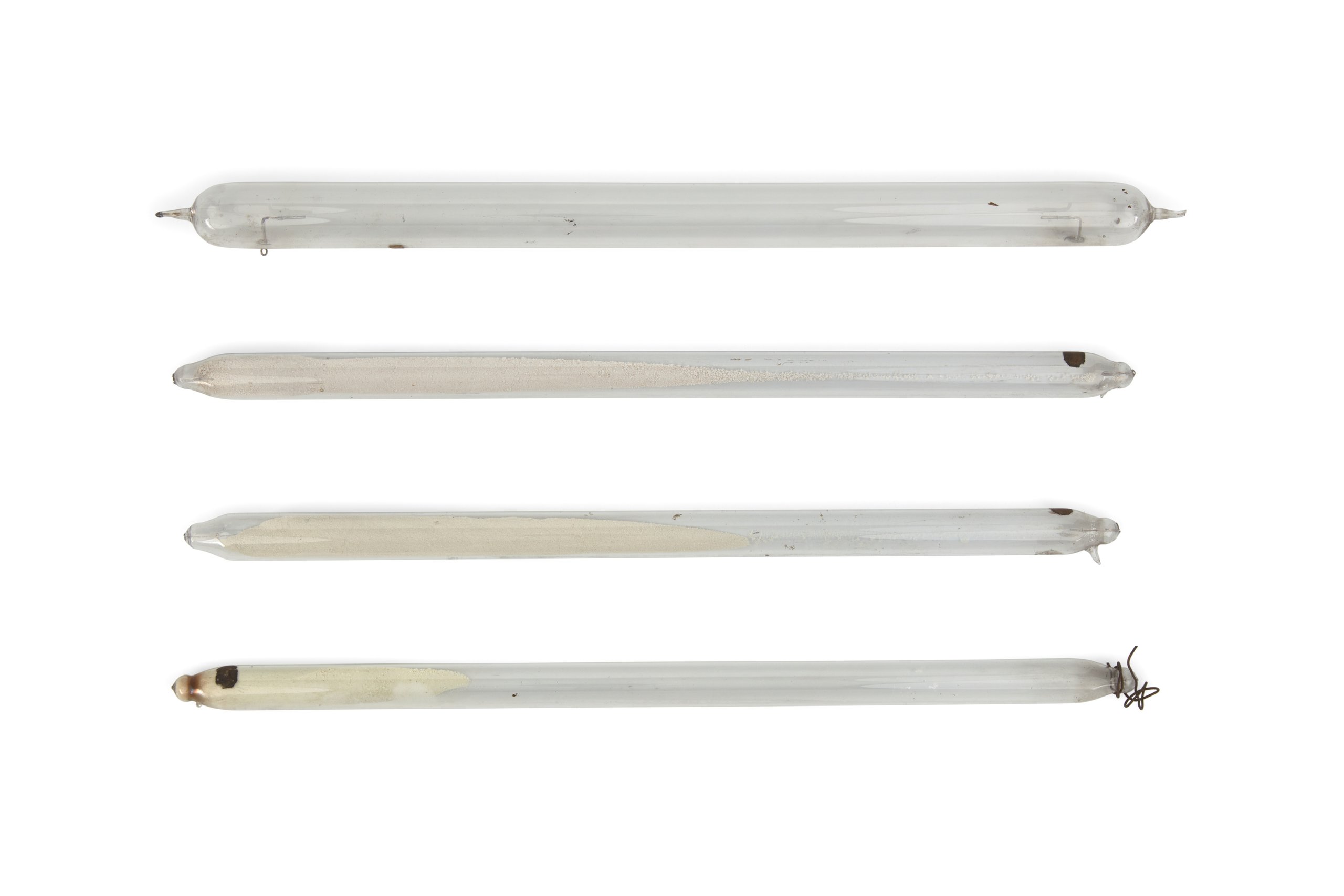 Three discharge tubes containing powders