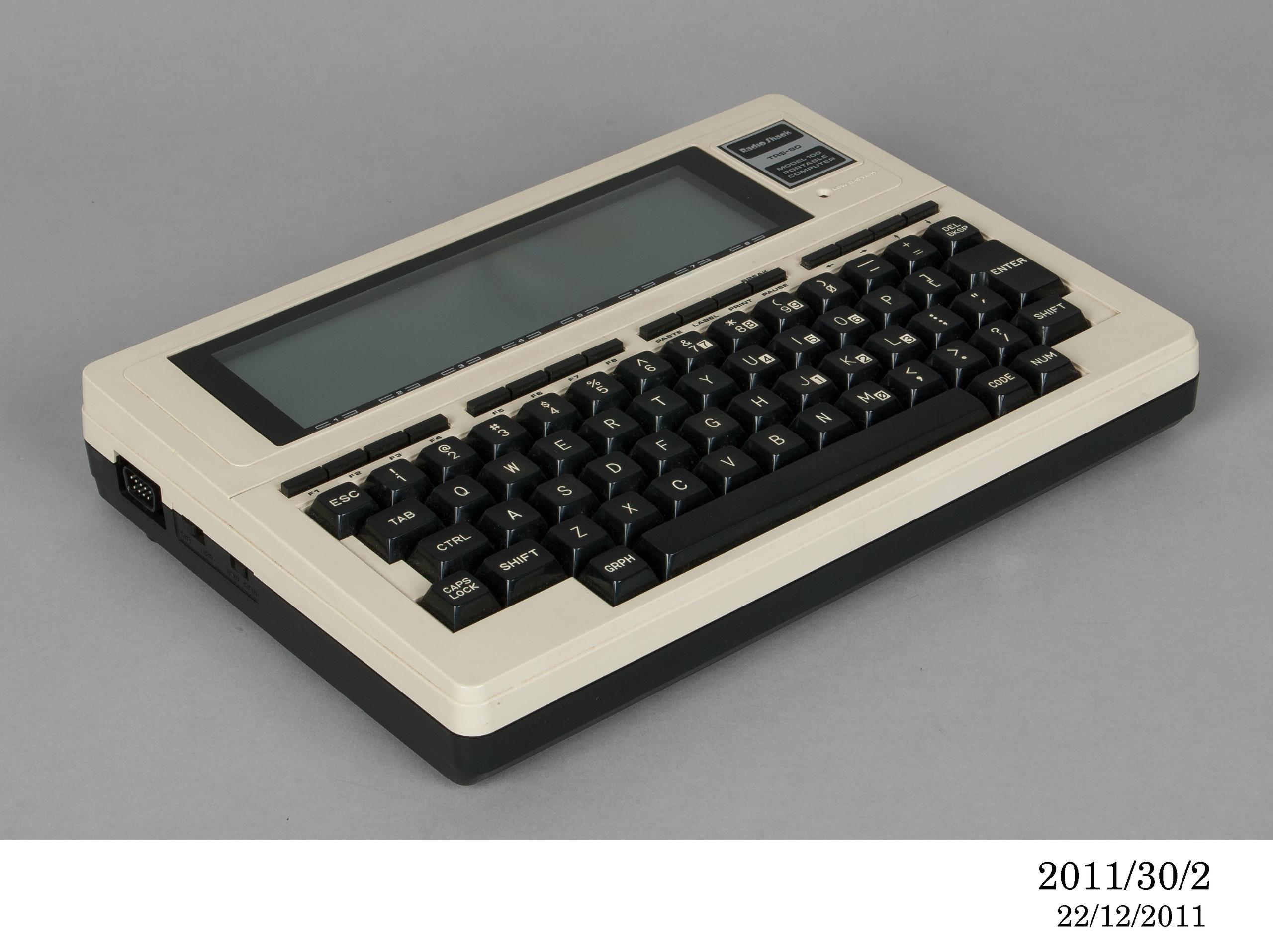 Powerhouse Collection - Portable disk drive by Tandy Corporation, 1983