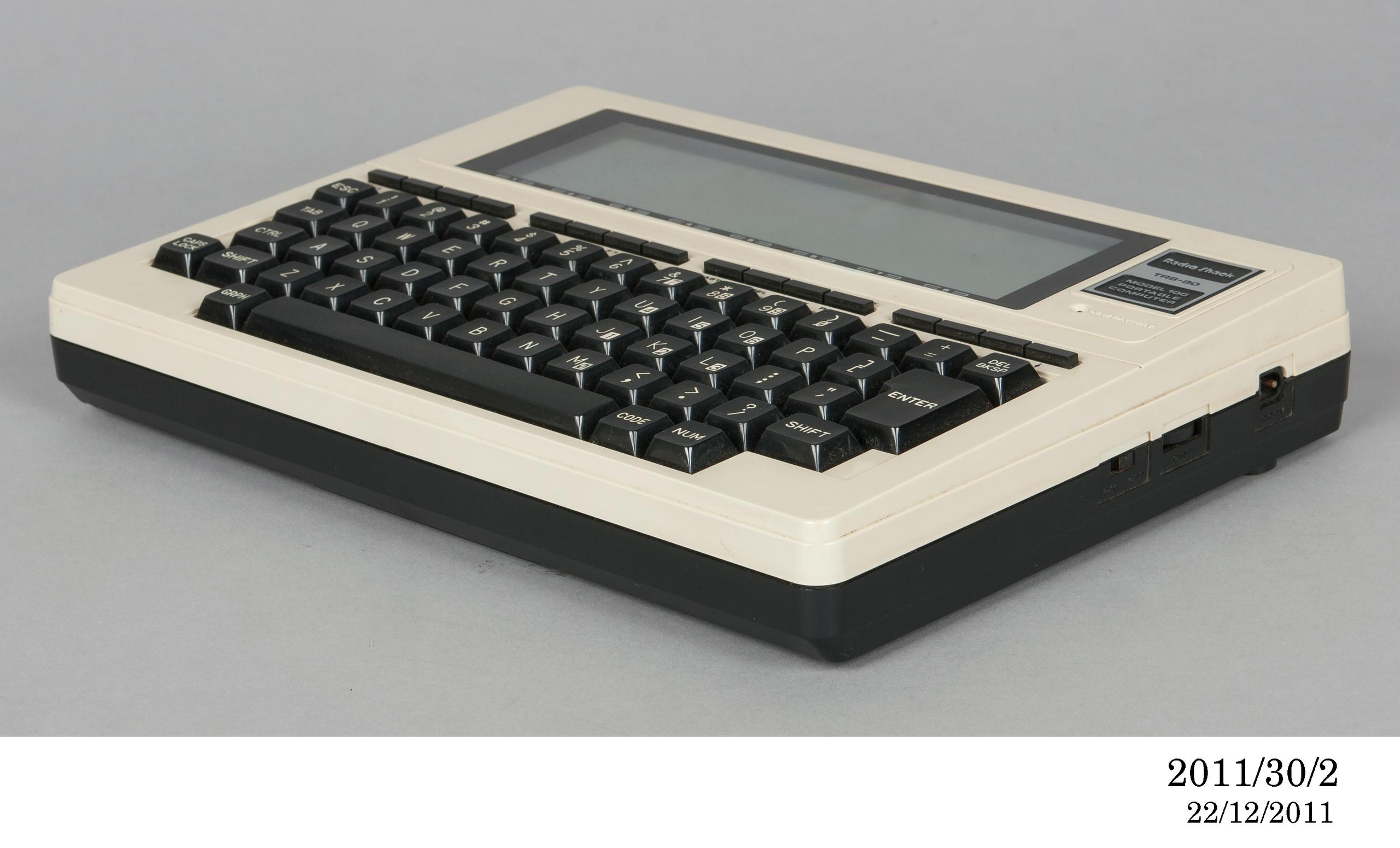 Powerhouse Collection - Portable disk drive by Tandy Corporation, 1983