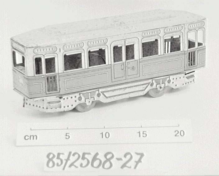 Red and cream tin plate toy tram