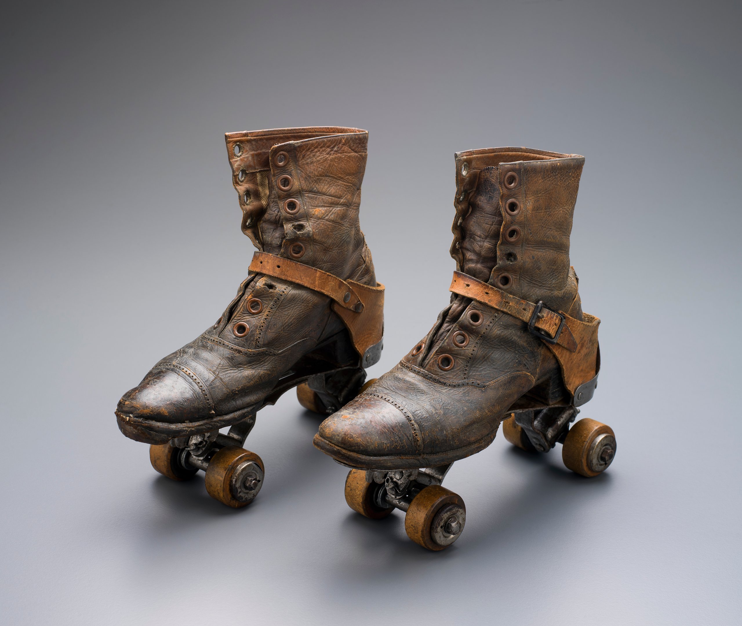 Pair of womens roller-skates owned by Elsie White of Saumarez Homestead and photographs