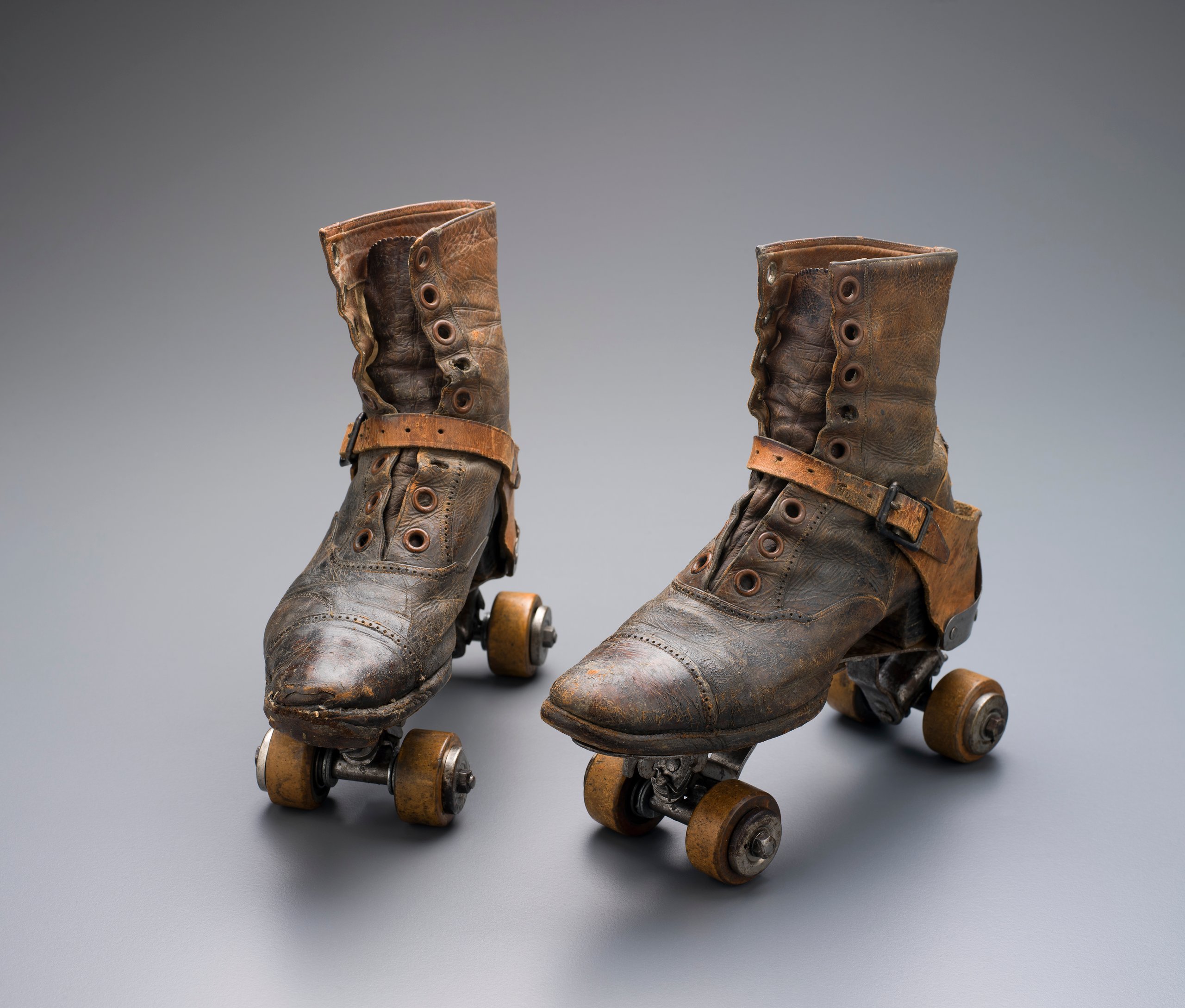 Pair of womens roller-skates owned by Elsie White of Saumarez Homestead and photographs