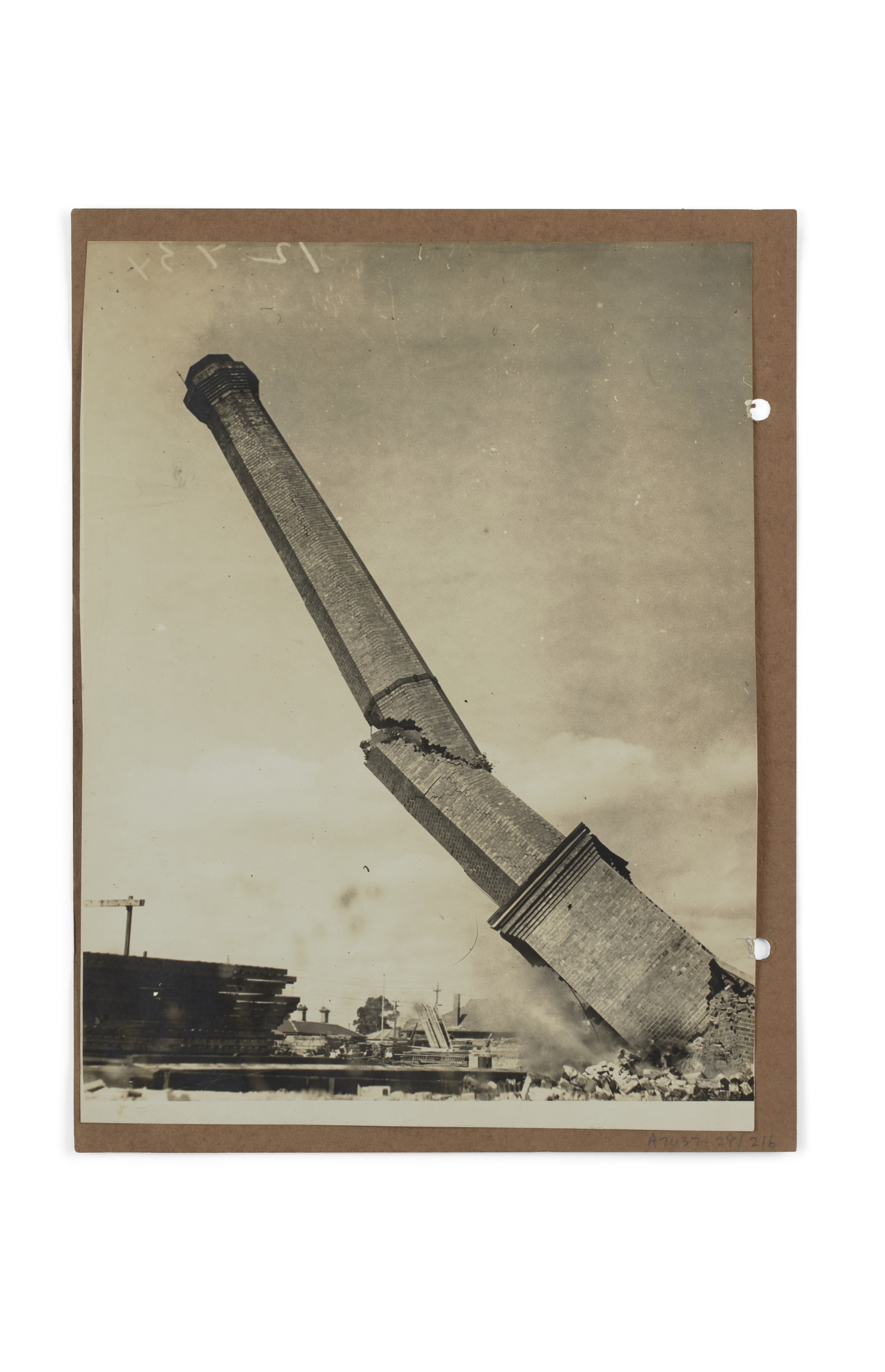 Photograph of demolition of Wunderlich tile factory chimney stack