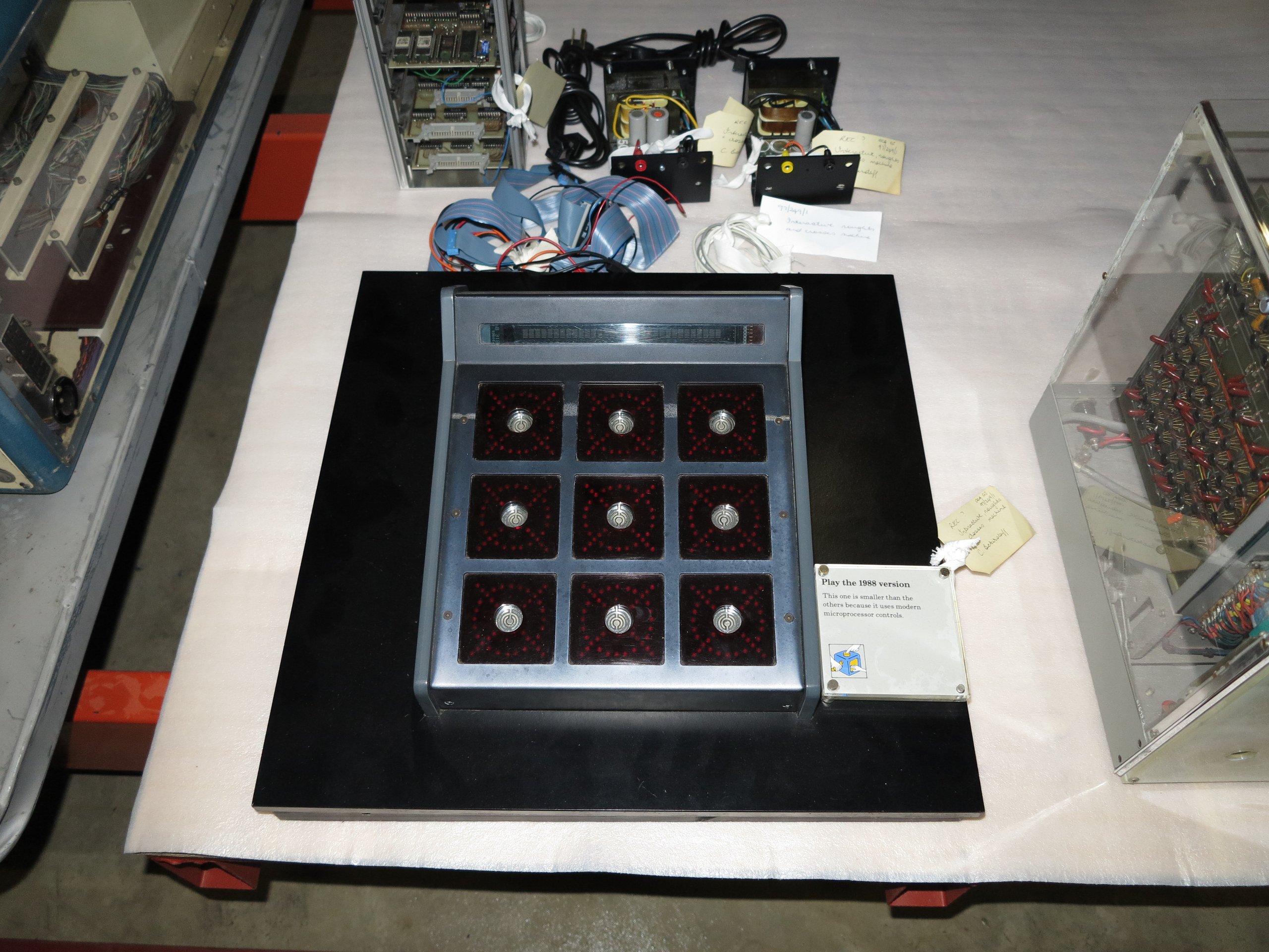 Microprocessor based interactive, noughts and crosses machine