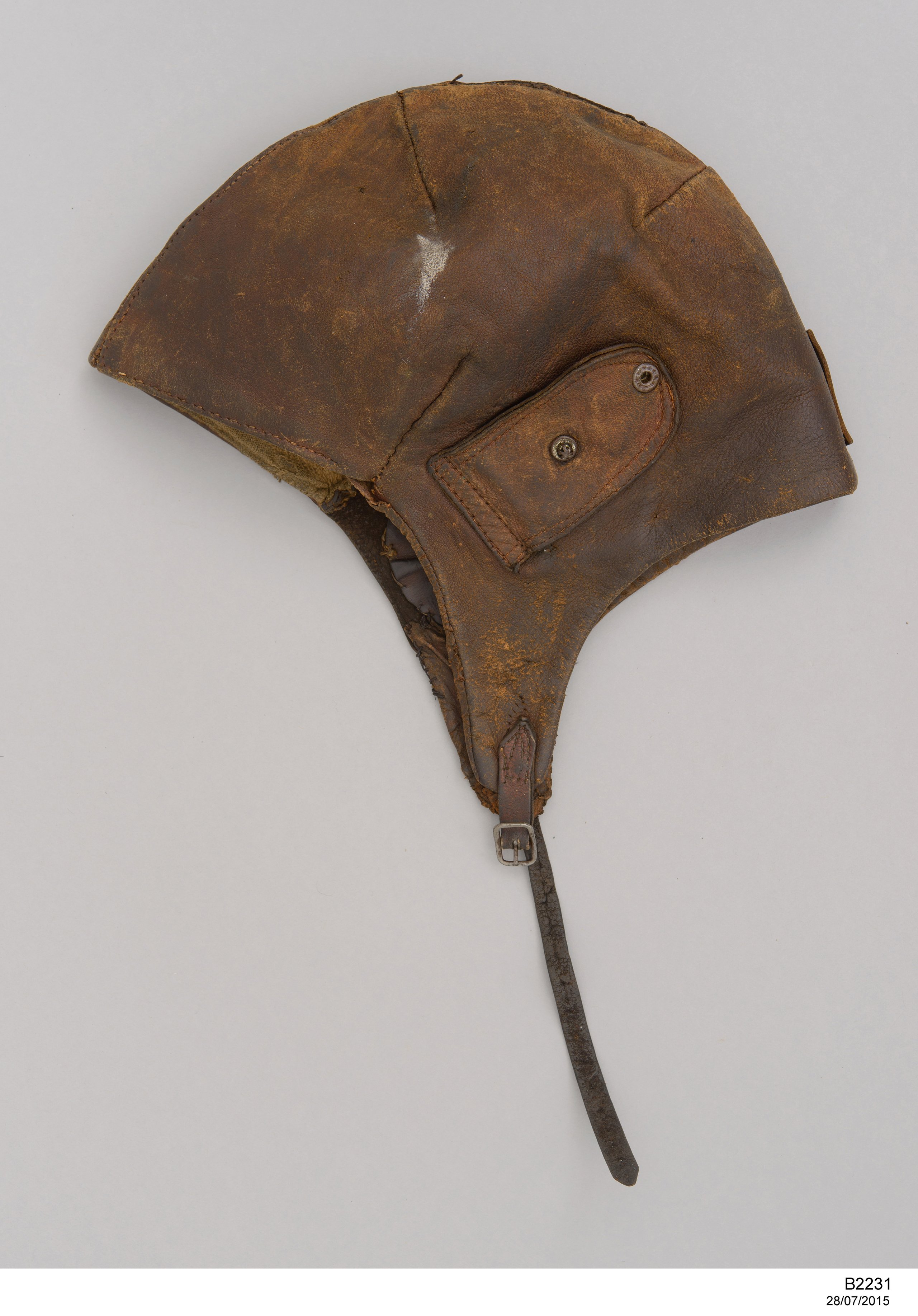 Flying helmet worn by Charles Kingsford Smith with fuel pipes from the 'Southern Cross'