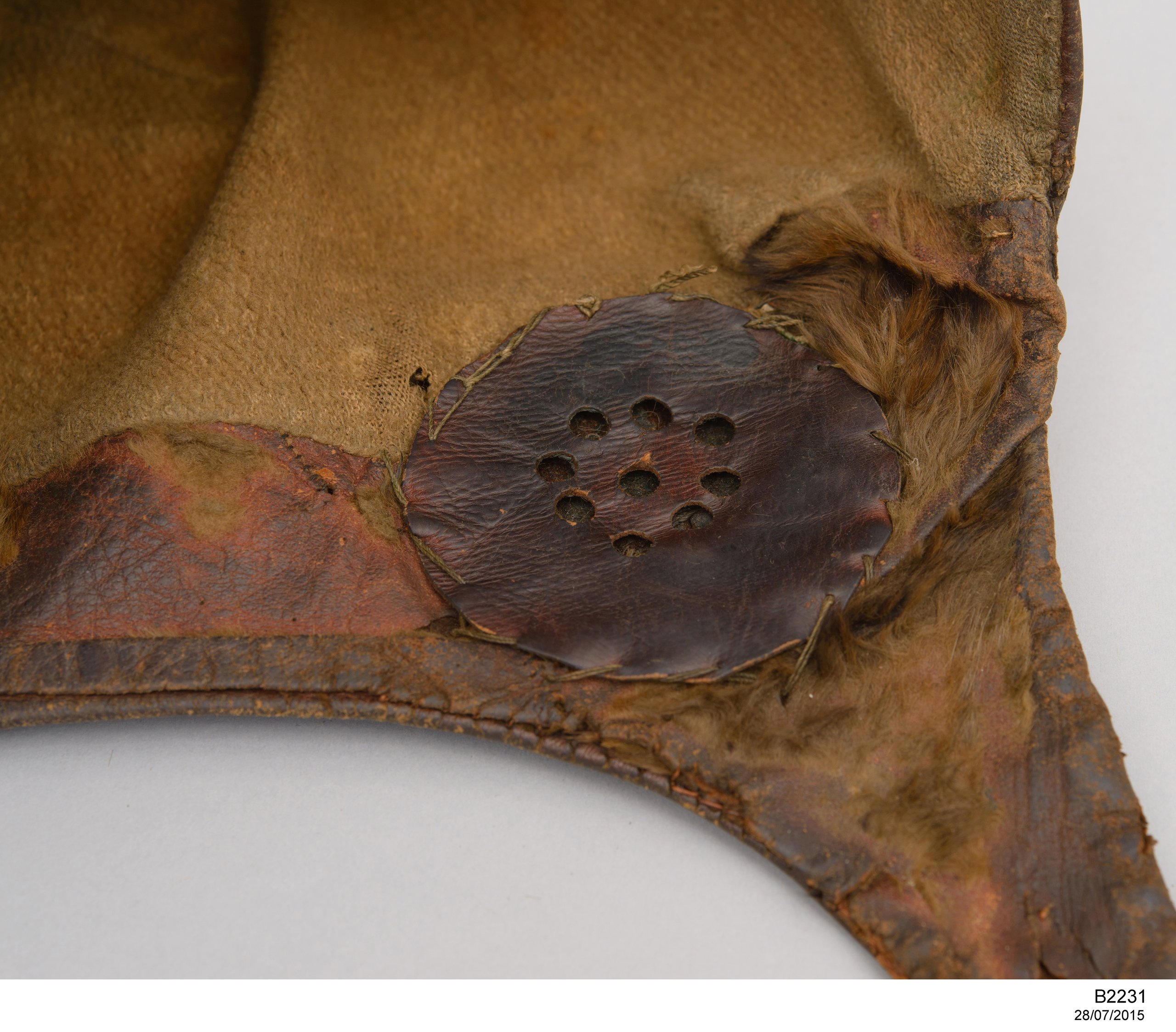 Flying helmet worn by Charles Kingsford Smith with fuel pipes from the 'Southern Cross'