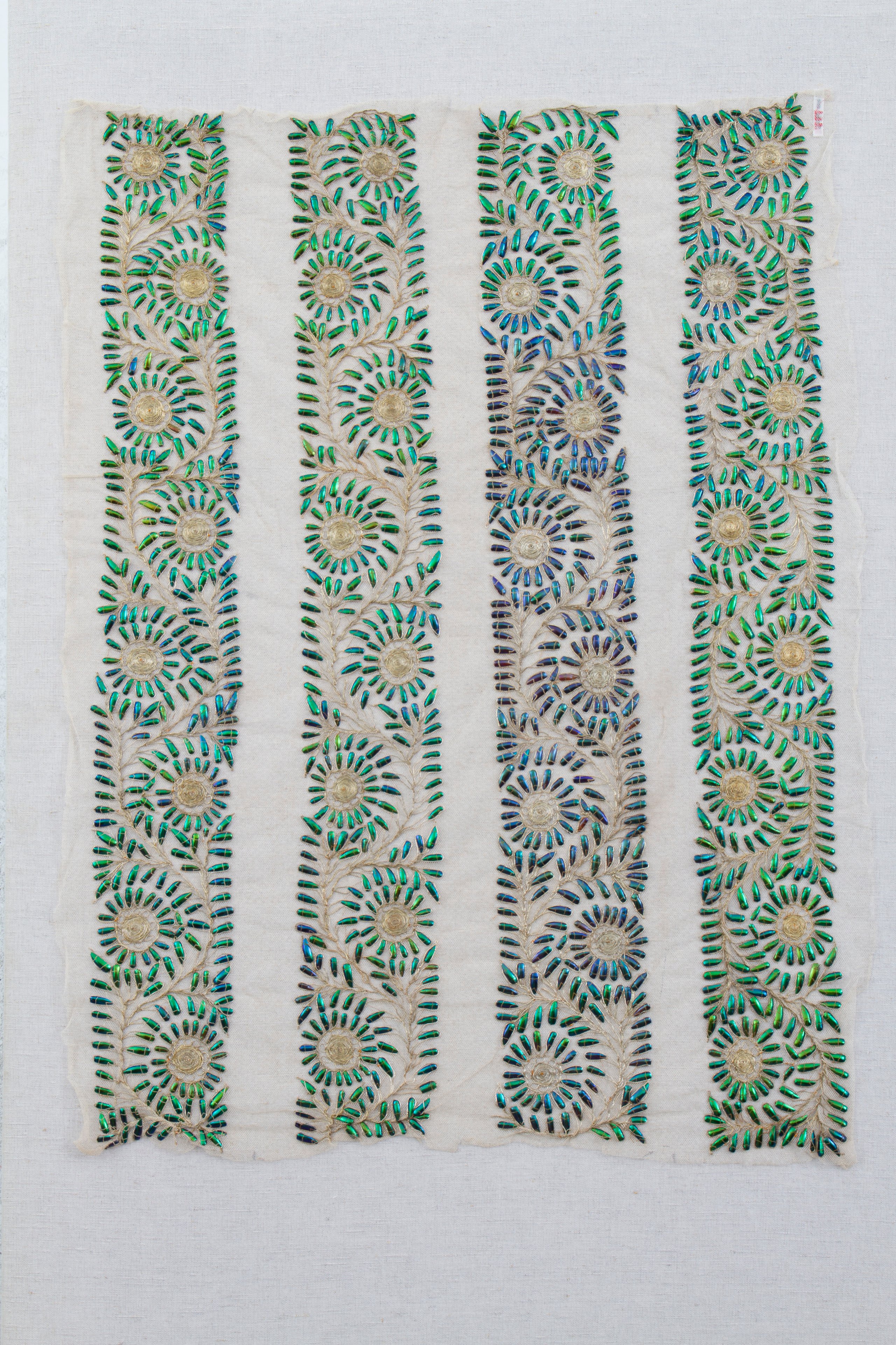 Textile length decorated with beetle wings, India