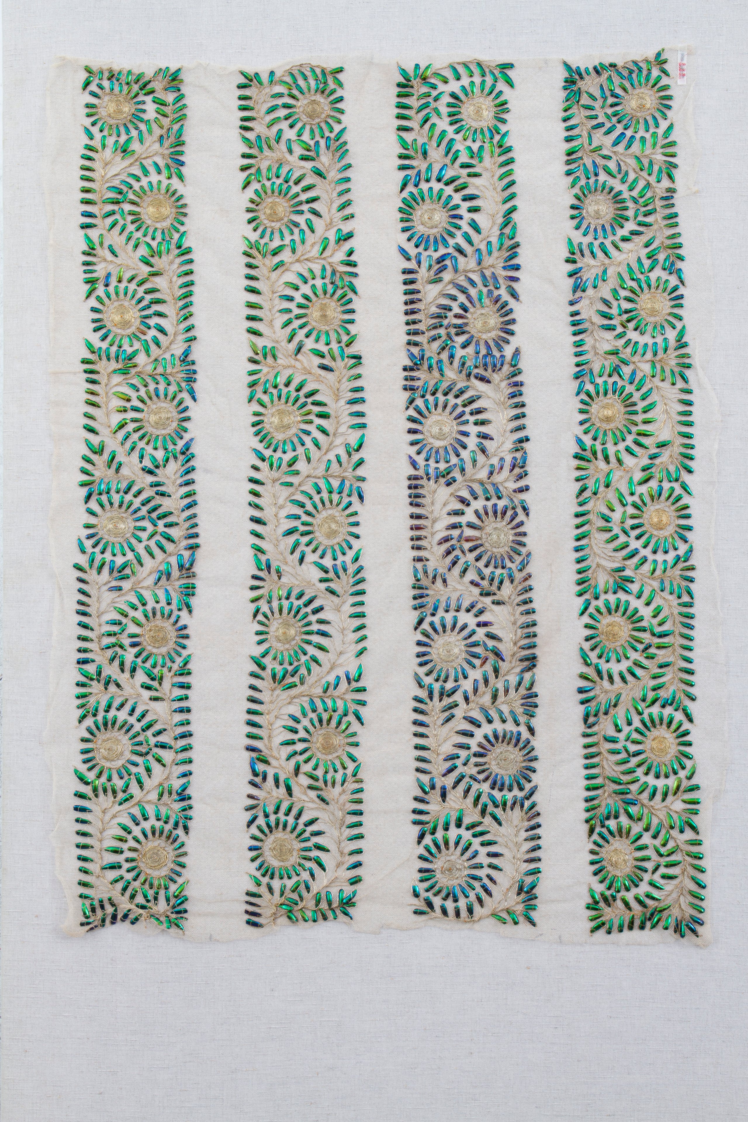 Textile length decorated with beetle wings, India