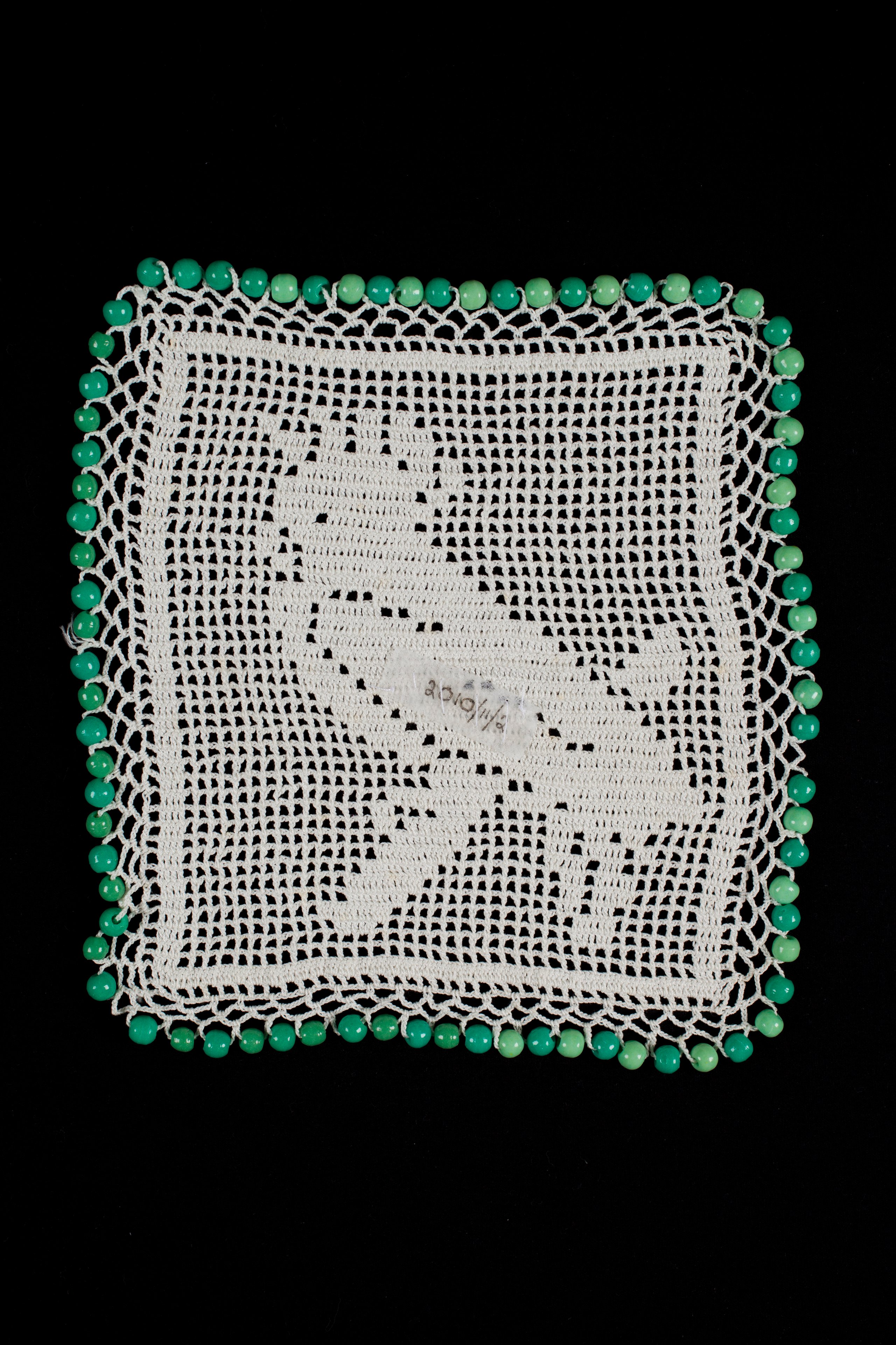 Filet crochet 'cockatoo' milk jug cover