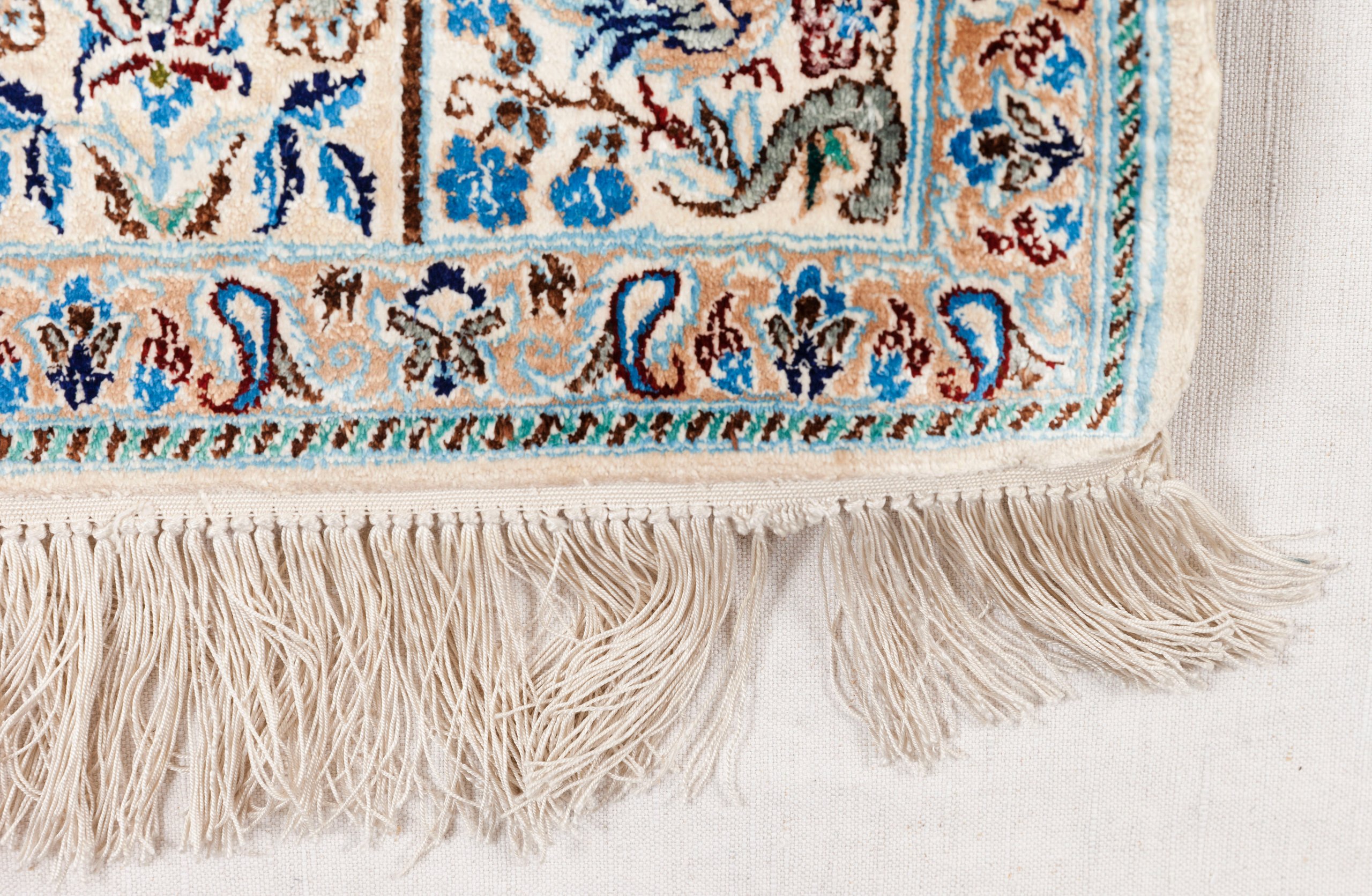 Hand knotted silk carpet by Haj Reza
