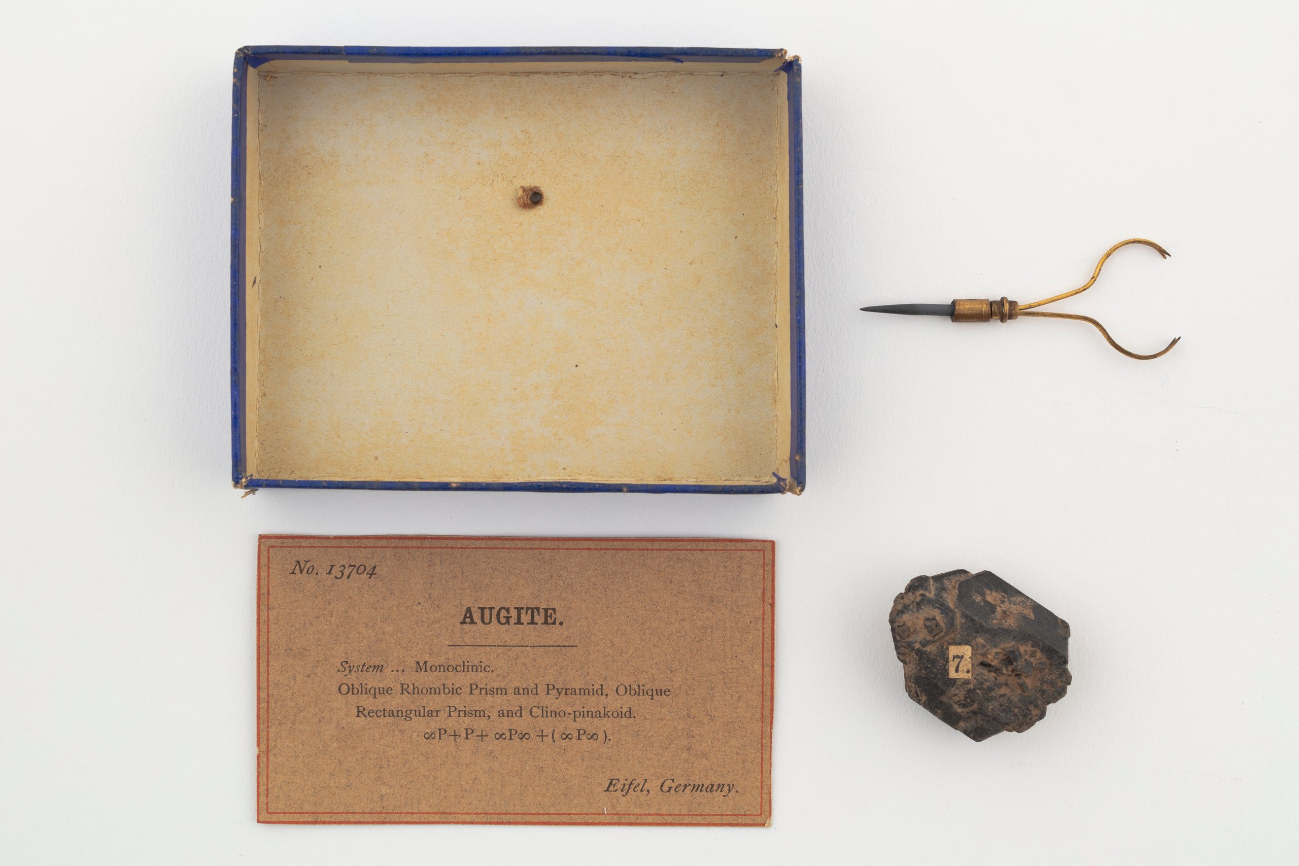 Augite mineral sample and accessories