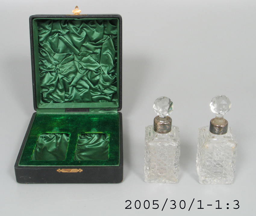 Two crystal and silver perfume bottles in case