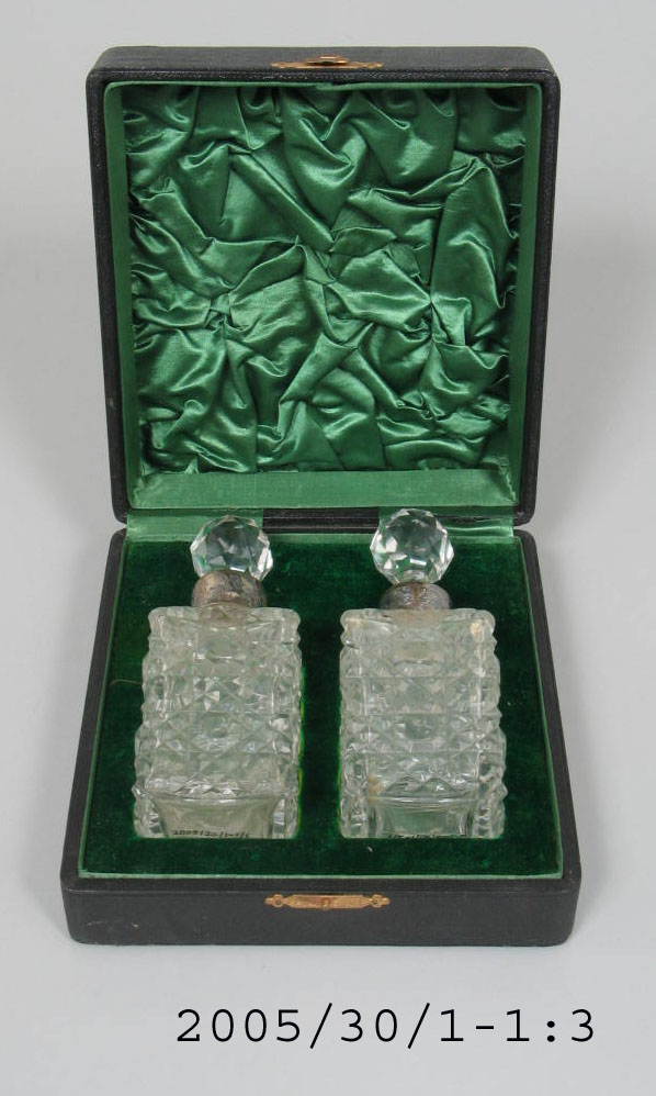 Two crystal and silver perfume bottles in case