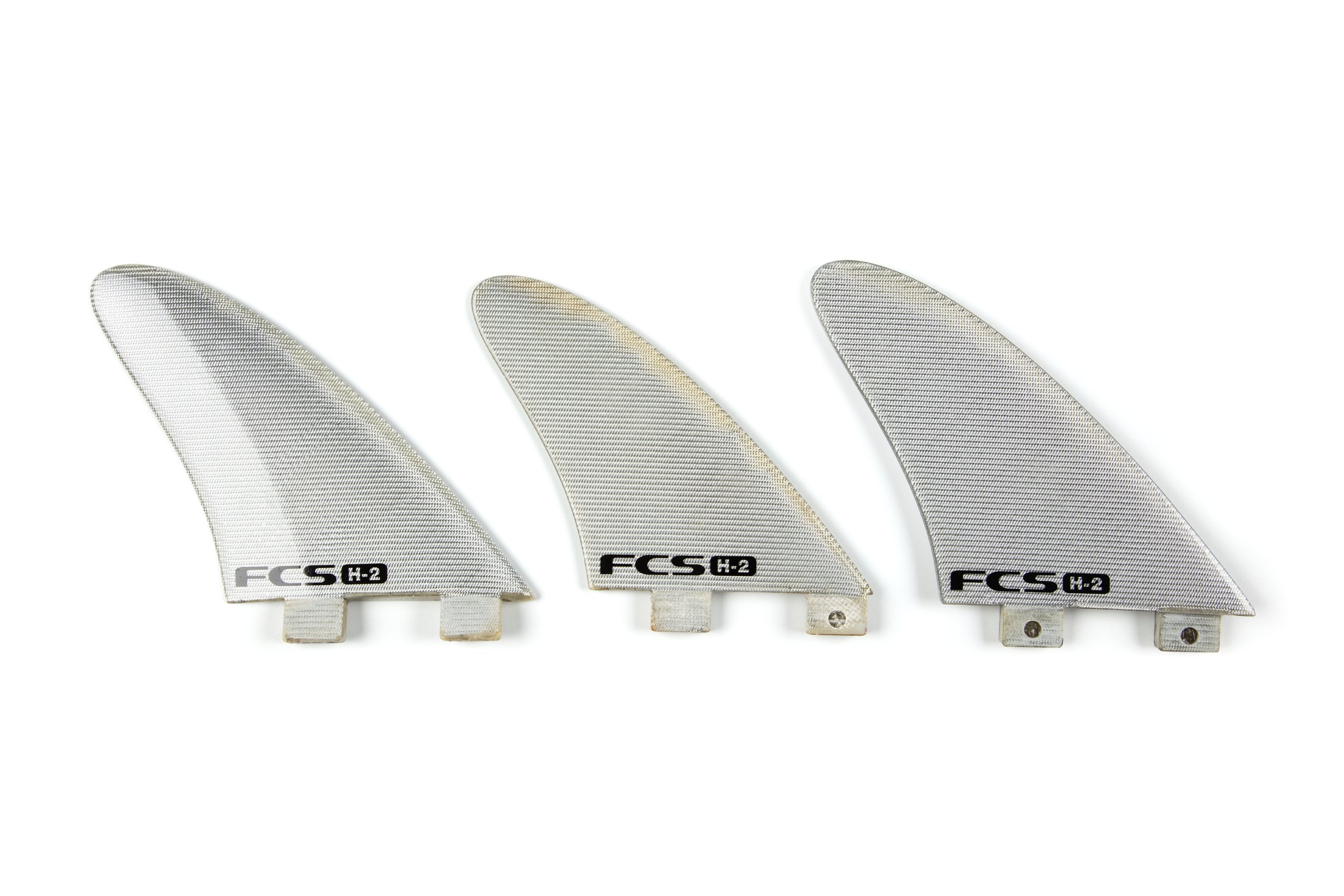 Three 'FCS H-2' surfboard fins