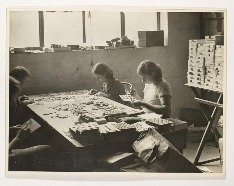 Photograph depicting workers at The Pearlbutton Manufacturing Co