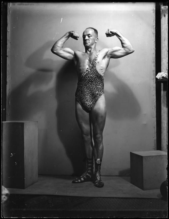 Glass plate negative of strongman Don Athaldo photographed by Tom Lennon