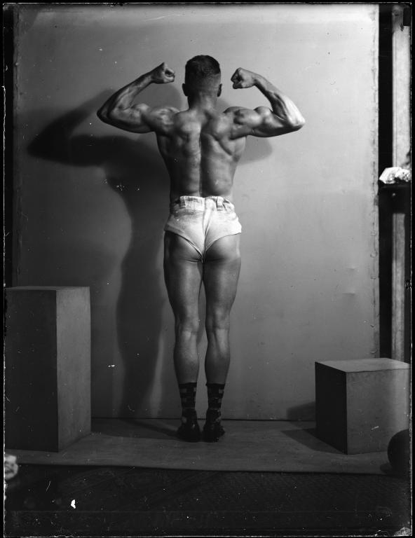 Glass plate negative of strongman Don Athaldo photographed by Tom Lennon