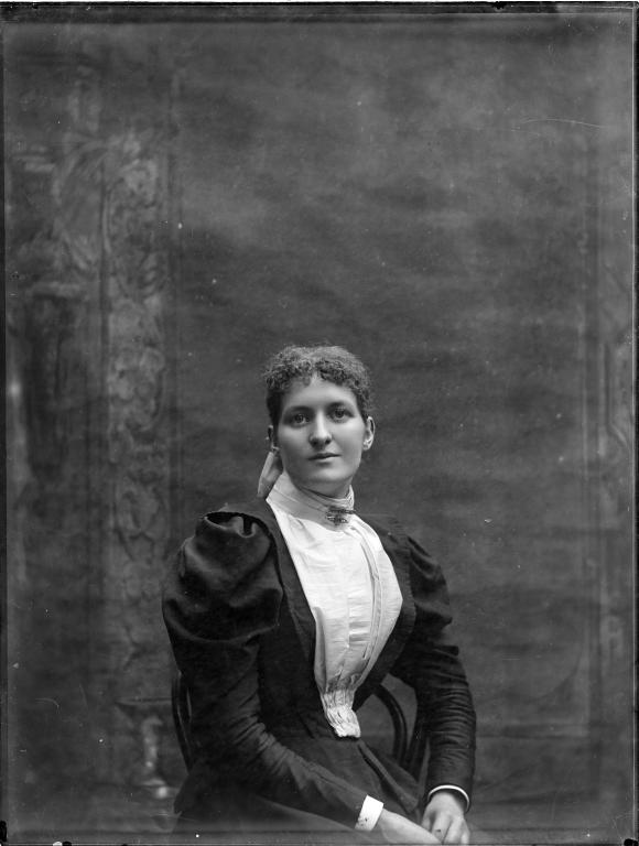 Glass plate negative of studio portrait of a young woman
