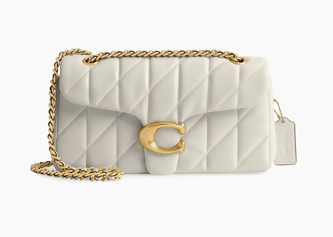 Additional raffle prize presentation for a Coach bag and wallet set