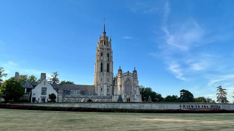Kirk in the Hills in Bloomfield Hills, Michigan, with its stone bell tower and landscaped grounds.