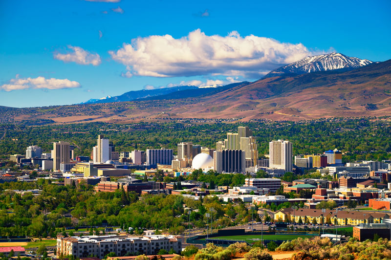 Downtown Reno, Nevada, with hotels, casinos and the Sierra foothills beyond.