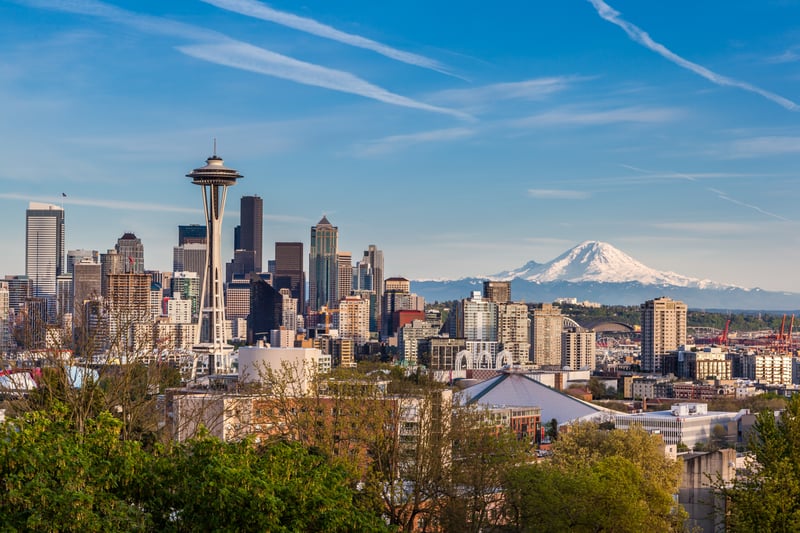 Seattle's skyline and Space Needle with Mount Rainier in the distance.