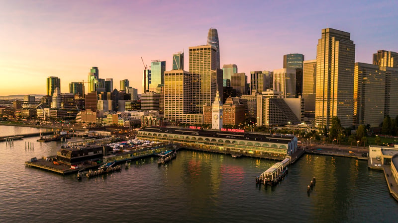San Francisco's waterfront and downtown skyline, with the Ferry Building beside the bay.