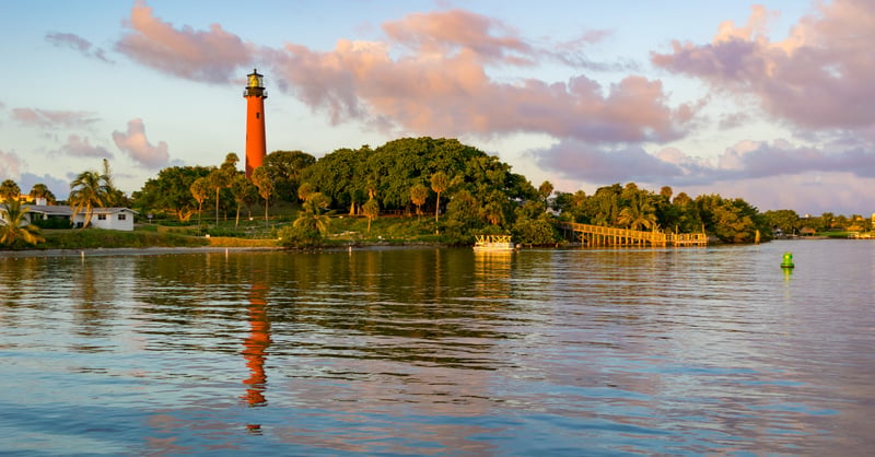 Jupiter Inlet Lighthouse overlooking the water in Jupiter, Florida, at dusk.