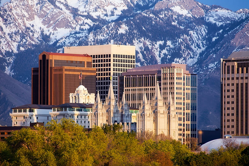 Temple Square and downtown Salt Lake City, Utah, beneath the snow-covered Wasatch mountains.
