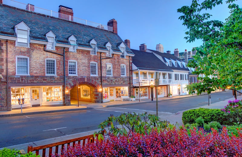 Brick storefronts and dormer windows around Palmer Square in Princeton, New Jersey.