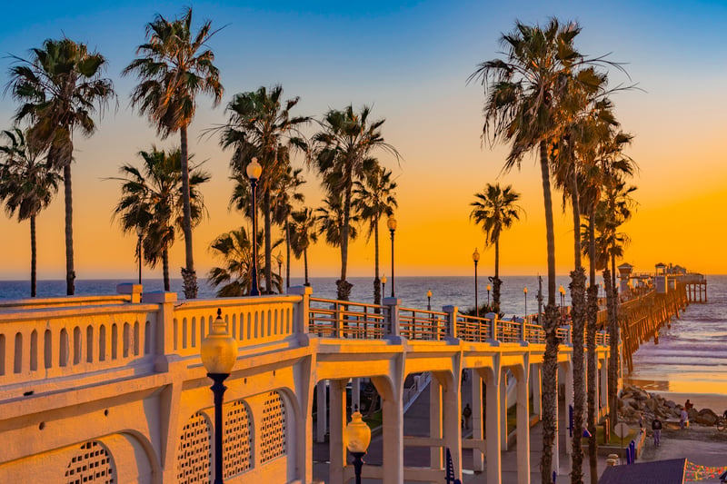 Oceanside Pier extending into the Pacific Ocean at sunset in northern San Diego County, California.