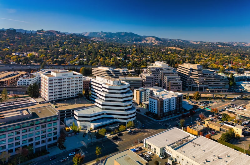 Aerial view of downtown Walnut Creek in Contra Costa County, California, with hills beyond.