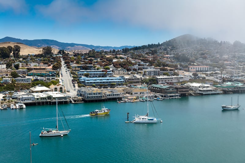 Boats and waterfront shops along the Embarcadero in Morro Bay, San Luis Obispo County, California.