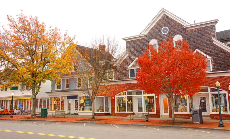 Shops and shingled buildings in Southampton, New York, on an autumn day.