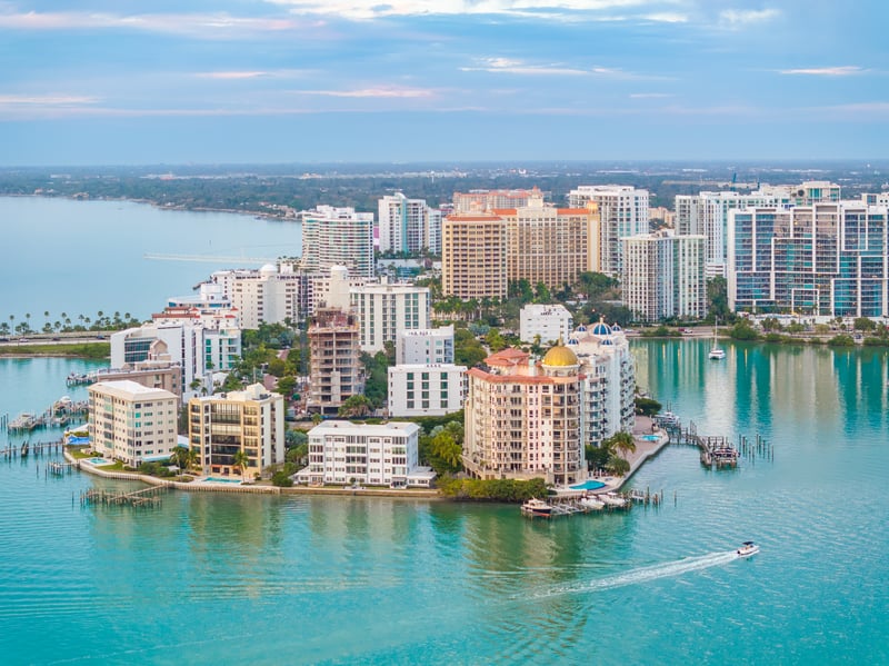 Downtown Sarasota, Florida, beside the bay, with marinas and boats along the waterfront.