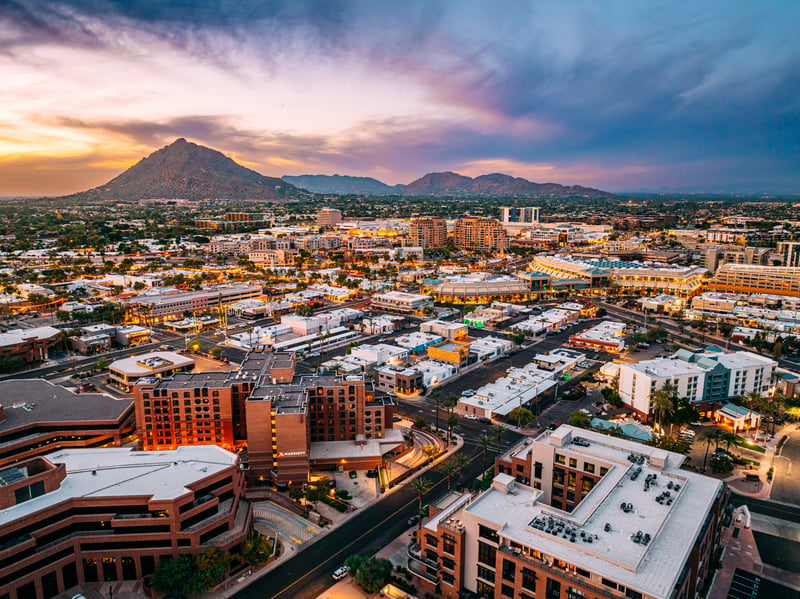 Old Town Scottsdale, Arizona, with Camelback Mountain beyond at sunset.