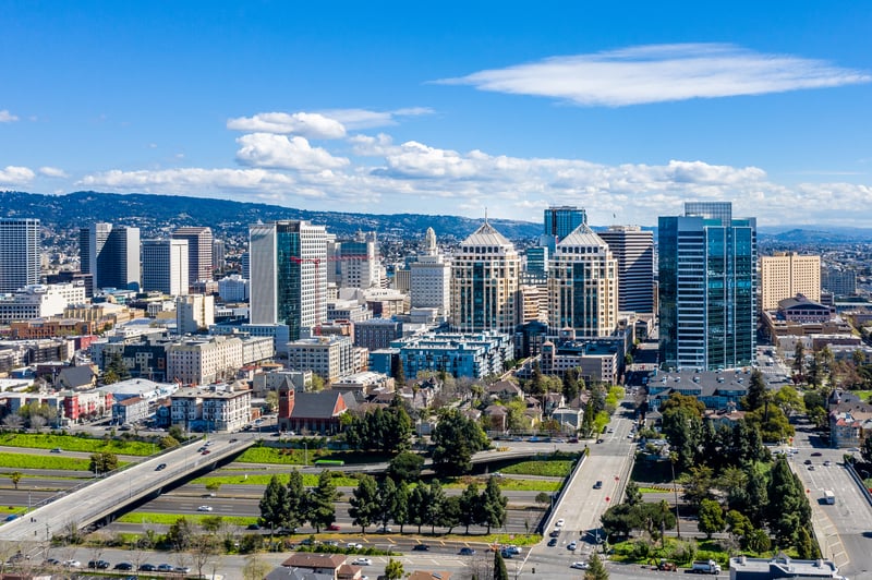 Downtown Oakland skyline in Alameda County, California, with the East Bay hills beyond.