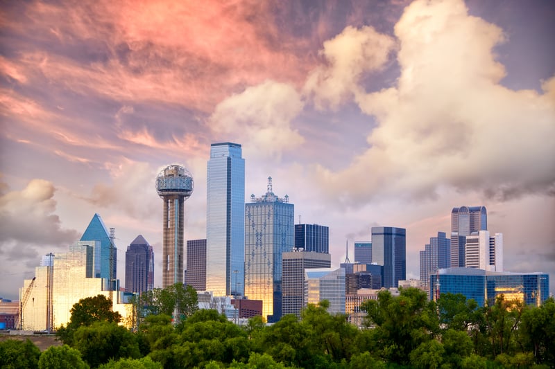 Downtown Dallas, Texas, at sunset, with Reunion Tower rising above the city.