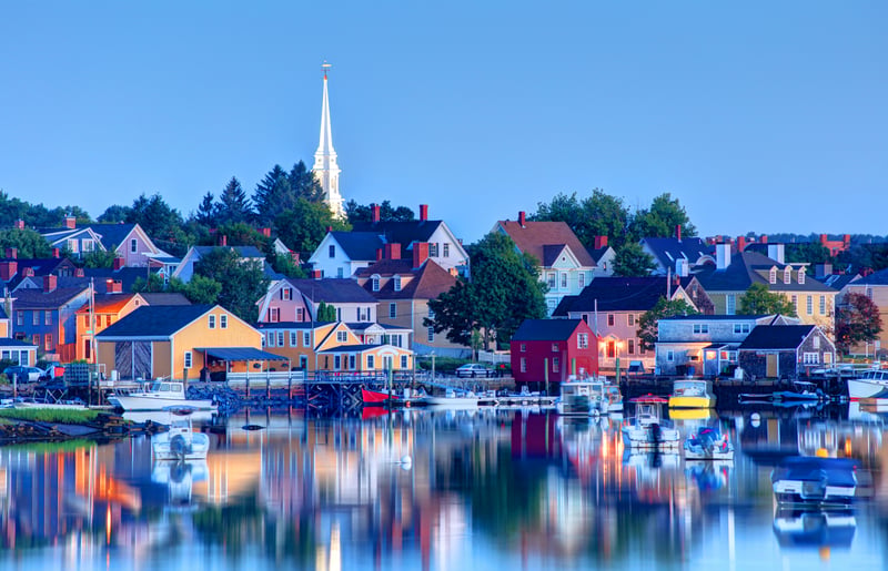Historic waterfront buildings and a church spire in Portsmouth, New Hampshire.