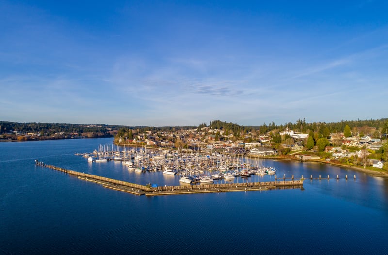 Aerial view of Poulsbo, Washington, with its waterfront marina and surrounding neighborhoods.