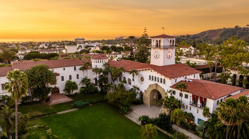 The Santa Barbara County Courthouse clock tower above its landscaped garden in California.