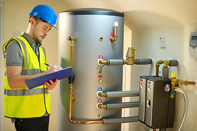 A professional check on a water heater.