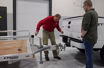 The trailer is lowered onto the ball mount using the crank wheel.