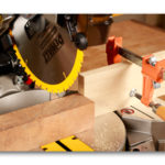 Dewalt miter saw with a stop block clamped to the outfeed side helps speed up repetitive cuts