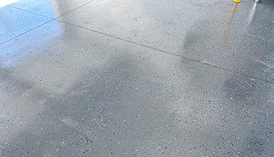 A finished epoxy garage floor.